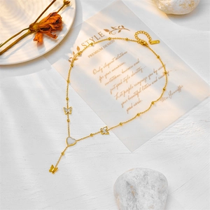 Elegant gold titanium steel necklace with butterfly heart charms and shell inlay details