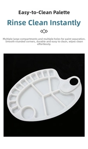 Close-up of white plastic paint palette with multiple wells and smooth rounded corners