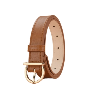Detail of a brown leather belt featuring a polished golden horseshoe buckle on white backdrop