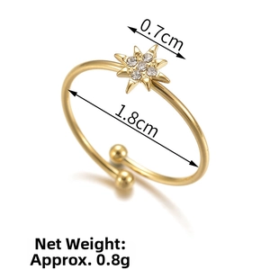 Technical view showing 1.8cm diameter and 0.7cm star detail of gold titanium ring