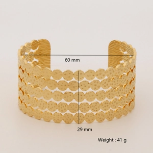 Detail view of golden wide cuff bracelet showing 29mm height and 60mm inner diameter