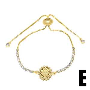 Detailed macro view of the gold-plated religious pendant with sparkling zircon inlays