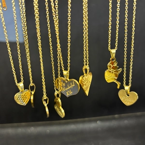 Gold titanium steel layered necklaces with heart, angel, and evil eye charm pendants