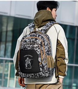 Detail of pixel camouflage tactical backpack featuring durable mesh side pocket for travel