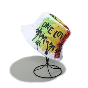 Detail of ONE LOVE print with tropical palm trees on a white cotton bucket hat