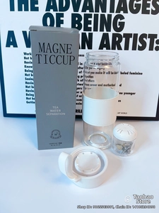 Detail view of magnetic tea water separation glass cup with leather sleeve and gift box