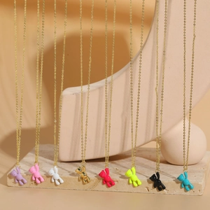 Detailed view of colorful bear pendants in eight shades on delicate gold chains