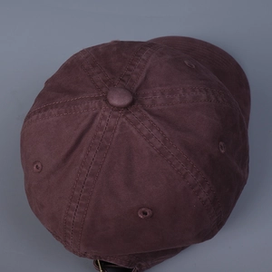 Close-up of the vintage cotton baseball cap crown with stitched eyelets and button