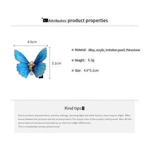 Tableau détaillé des tailles avec dimensions et matériaux de la barrette papillon bleue