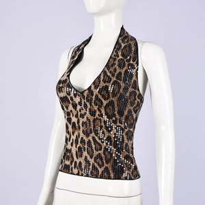 Close-up of sparkling leopard print sequins on a backless halter neck crop top for women
