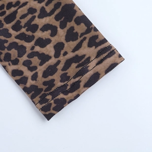 Close-up of leopard print top showing detailed stitching and elastic knit fabric texture
