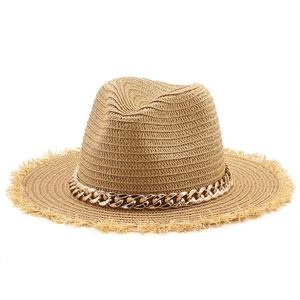 Classic straw fedora hat with gold metal chain and frayed edges for summer vacation style