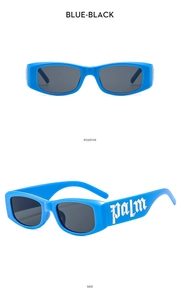 Detail view of blue kids sunglasses featuring gothic silver palm lettering and dark lenses
