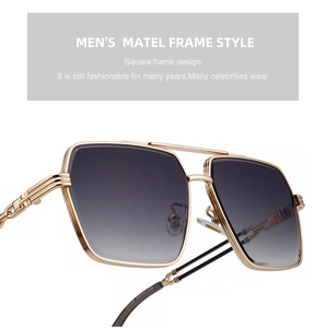 Detail of gold metal frame sunglasses with gray gradient lenses and chain temple decor