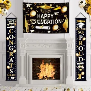 Detail of black and gold graduation banner set with Happy Graduation and balloon motifs