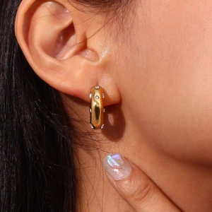 Fashionable 18K gold plated stainless steel C-shaped earrings with zircons on model