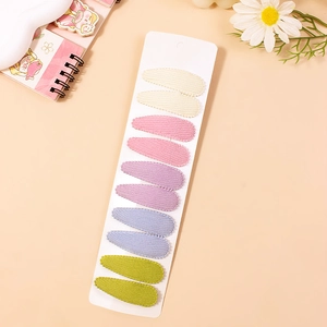 Set of 10 floral fabric drop hair clips in five pastel colors on a white card display