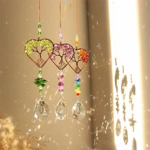 Three heart-shaped Tree of Life crystal suncatchers with colorful hanging prism pendants