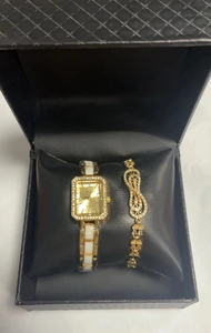 Elegant gold square quartz watch and infinity bracelet set in a black quilted gift box