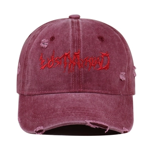 Detailed close-up of vintage distressed baseball cap with gothic LOSTMYHEAD embroidery