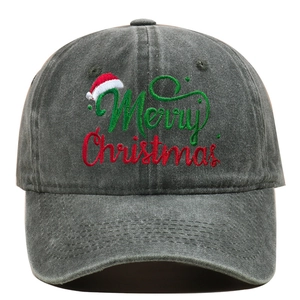 Close-up of Merry Christmas embroidery and washed gray cotton fabric on a baseball cap
