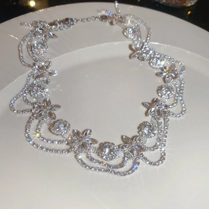 Detailed view of layered floral pearl necklace with sparkling rhinestones and tassels