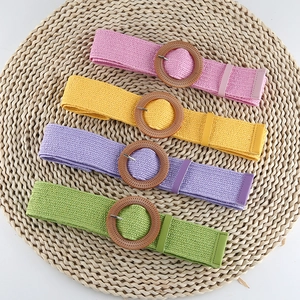 Bohemian elastic woven waist belts in pink, yellow, purple, and green with round wooden buckles