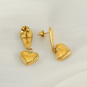 18K gold plated stainless steel heart earrings with radiant texture on white silk background