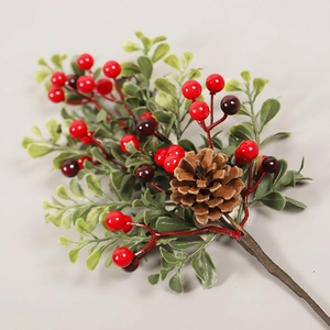 Christmas berry branch decoration with red berries, pine cones and green foliage