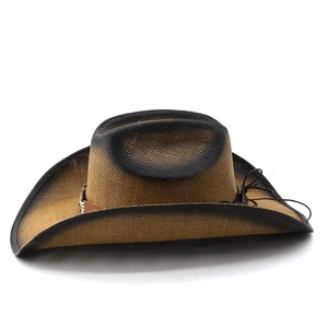 Detail of hand-woven straw cowboy hat with leather trim and gradient burnt finish