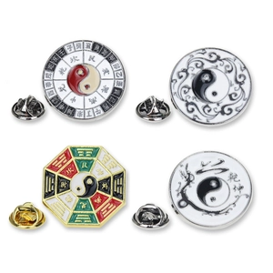 Detail of four Yin Yang Bagua enamel pins with traditional Chinese characters and butterfly clutch