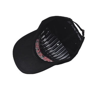 Close-up of black cotton baseball cap interior with adjustable metal buckle and printed brim