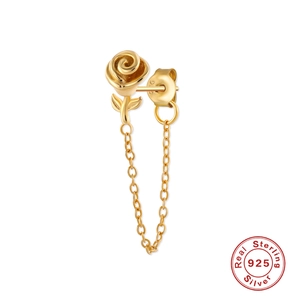 Close-up of golden S925 sterling silver rose stud earring with a delicate tassel chain
