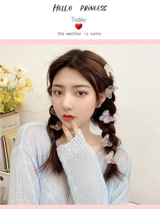 Iridescent butterfly hair clip set showing colorful laser effect on model hairstyle
