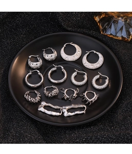 Detailed set of assorted 925 silver vintage earrings in minimalist geometric styles