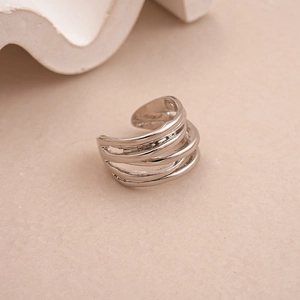 Detailed view of silver polished geometric bean rings with minimalist layered metal design