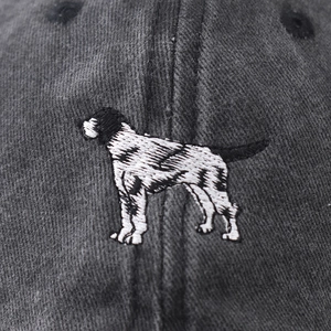 Distressed dark gray cotton baseball cap featuring detailed embroidered dog pattern