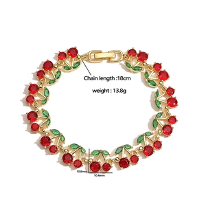 Luxury gold cherry bracelet with red and green cubic zirconia stones and measurements