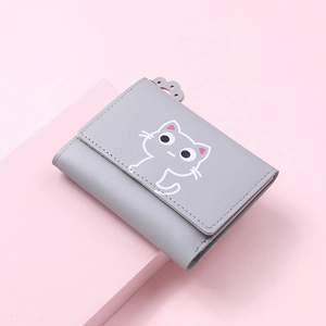 Close-up of light gray PU leather wallet featuring white cartoon cat print and snap closure