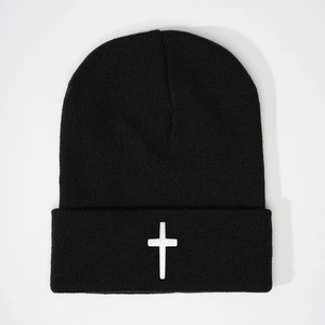 Close-up of black knitted beanie featuring high-quality white cross embroidery detail
