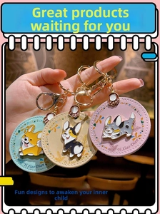 Detailed view of handmade leather Corgi dog keychains in pastel mint, beige and pink