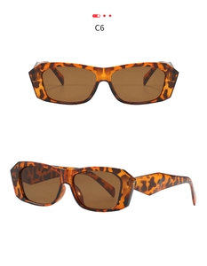 Close-up of retro polygon sunglasses with leopard print frames and dark brown lenses