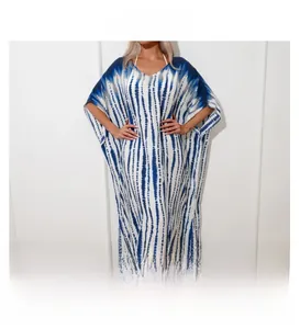 Detailed view of the V-neckline and blue tie-dye pattern on the bohemian beach kaftan dress