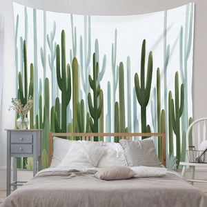 Bedroom wall decor featuring a large hand-drawn cactus tapestry above a bed set