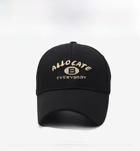 Close-up of premium black cotton baseball cap featuring detailed beige letter embroidery