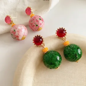Vintage palace style ceramic round pendant earrings in red and green with gold plating
