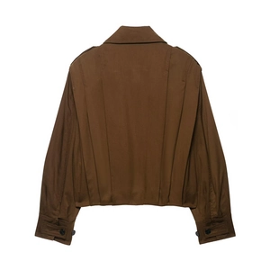 Rear view of a brown cropped jacket showing sleeve cuff buttons and back pleat detail