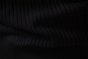 Close-up of black ribbed knit texture on men's cotton henley shirt fabric detailing