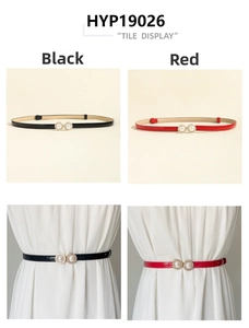 Detail of elegant slim belt featuring double pearl and rhinestone buckle on white dress