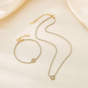 Elegant gold-plated tennis jewelry set with heart pendants and sparkling zircons
